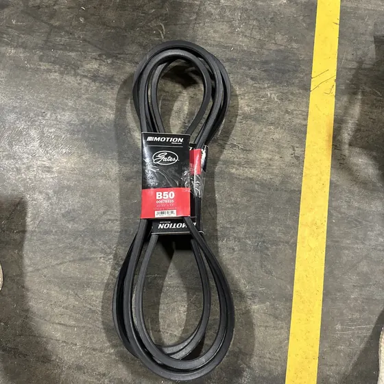Gates B50 V-belt coiled on the warehouse floor with its Motion Industries label