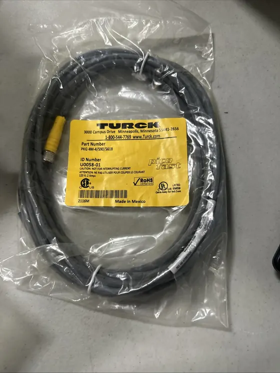 Turck PKG 4M-4 sensor cordset coiled in a sealed bag with the yellow Turck label