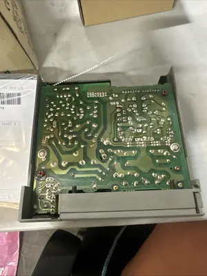 Allen-Bradley SLC 500 power supply module with its cover off, showing the board